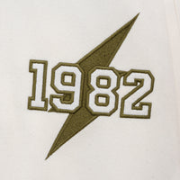 Kvetinová vysokoškolská bunda béžová