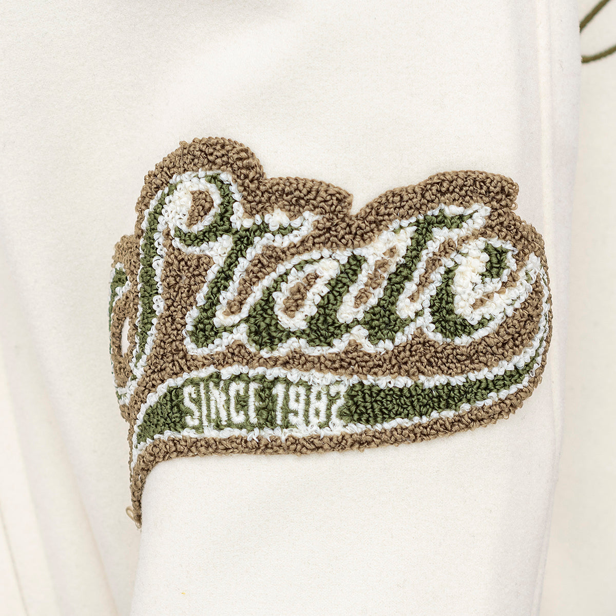 Kvetinová vysokoškolská bunda béžová